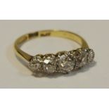 An 18ct gold, five stone diamond ring, approx 1.