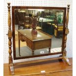 A George III mahogany dressing mirror, rectangular plate, turned and blocked uprights.