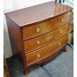 A George III bow front chest of three graduated drawers