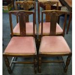Four Ercol oak dining chairs, carved top rail, drop in seats,