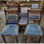A harlequin set of seven oak dining chairs.