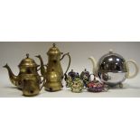 A plated tea and coffee set comprising teapot set with blue glass cabachons reverse cut with star