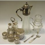 Three silver topped jars; a claret jug with plated mount ; a plated cruet; other plated ware.