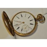 A 14ct gold half hunter pocket watch with subsidiary seconds dial, top wind.