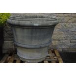 A large pair of composite planters of ribbed krater shape. 83cm high.