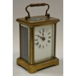 An early 20th century lacquered brass carriage clock