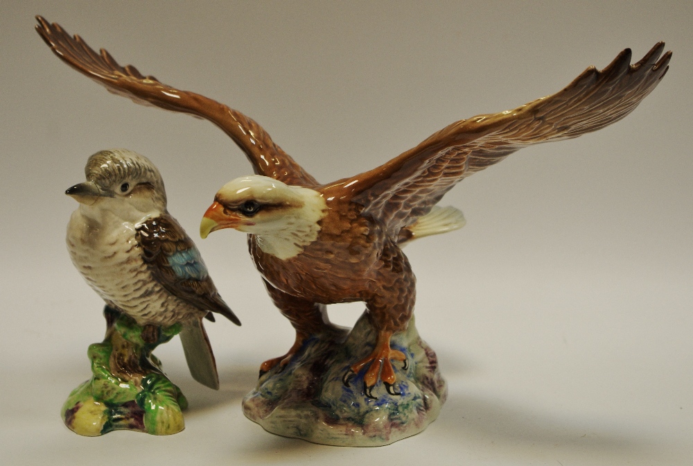 A Beswick model of a bald eagle on a rocky outcrop, impressed pattern no.