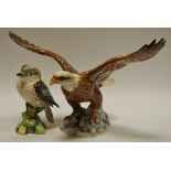 A Beswick model of a bald eagle on a rocky outcrop, impressed pattern no.