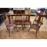 Four Ercol Quaker 365 style dining chairs.