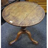 A George III oak tilt top occasional table, circular top, turned column, cabriole legs.