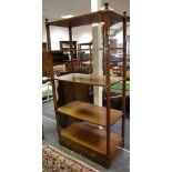 A contemporary campaign type open bookcase brass mounts, four shelves above on long drawer.