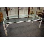 A large glass topped, bamboo conservatory table. 76cm high x 240cm long x 100cm wide.