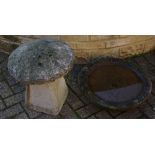 A reconstituted stone staddle stone; a stone bird bath.
