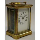 An early 20th century lacquered brass carriage clock