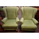 A pair of contemporary wingback armchairs;