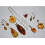 Silver and Baltic amber jewellery various pendants, 2 pairs of drop earrings,