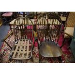 An Ercol spindle back rocking chair; an Ercol spindle back armchair.