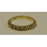 An 18ct gold and diamond half eternity ring, approx 0.