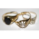 Three 9ct gold rings, one set with a diamond,