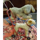 Toys - a large baby stroller/rocker in the form of a rabbit; another stroller, terrier.