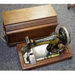 A cased hand powered Singer sewing machine serial no.