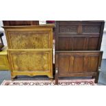 A carved oak single bed head and footboard; a quarter veneered walnut single bed head and footboard.