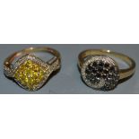 A fancy black and white diamond cluster ring, white metal setting, 9ct gold shank; another,
