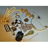 A sliver charm bracelet; jet brooch; pen knife; faux peals;