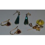 A pair of 9ct gold and garnet earrings;