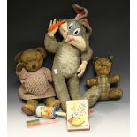 Toys and Juvenalia - a 1960's pull string Bugs Bunny plush toy; a mid 20th century Teddy bear;