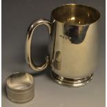 A silver christening mug, Birmingham 1930s; a silver napkin ring,
