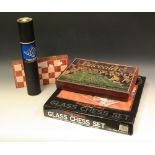 A glass chess set; a Baccalite electronic roulette game boxed; a magnetic chess set;