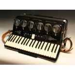A Parrot piano accordion, with full size treble keyboard and bass buttons,