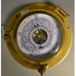 A reproduction wall hanging ships barometer, tinted dial and register,