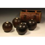 A pair Lignum Vitae bowls in case;