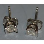 A Pair of diamond ear studs