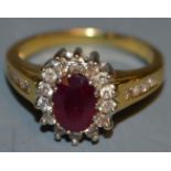 An 18ct gold ruby and diamond cluster,