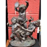 French School, a substantial dark patinated bronze, of revelling Bacchic putti, traces of verdigris,