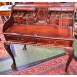 A Chippendale style mahogany escritoire, the shaped superstructure with five secret compartments,