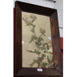 An Arts and Crafts needlework, butterflies on thistles, oak framed,