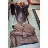 A leather saddle, dray jacket,