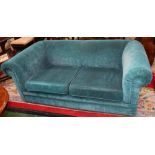 A contemporary Chesterfield shaped scroll arm sofa,