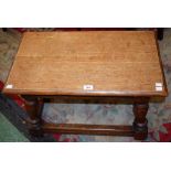 A 17th century style oak joint type stool, oversailing rectangular top above a nulled frieze,