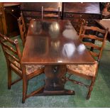 An oak trestle type dining table, 153.