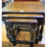 An oak nest of three tables