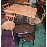 An Ercol light elm dining table,