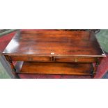 An oak coffee table, moulded rectangular top above a pair of frieze drawers,