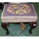 A George III style mahogany stool, cabriole legs carved and applied to the knees with bell husks,