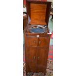 A mahogany cased Trutone gramophone cabinet; another, similar,