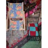 A Victorian style wrough iron dolls bed frame with hinged canopy;